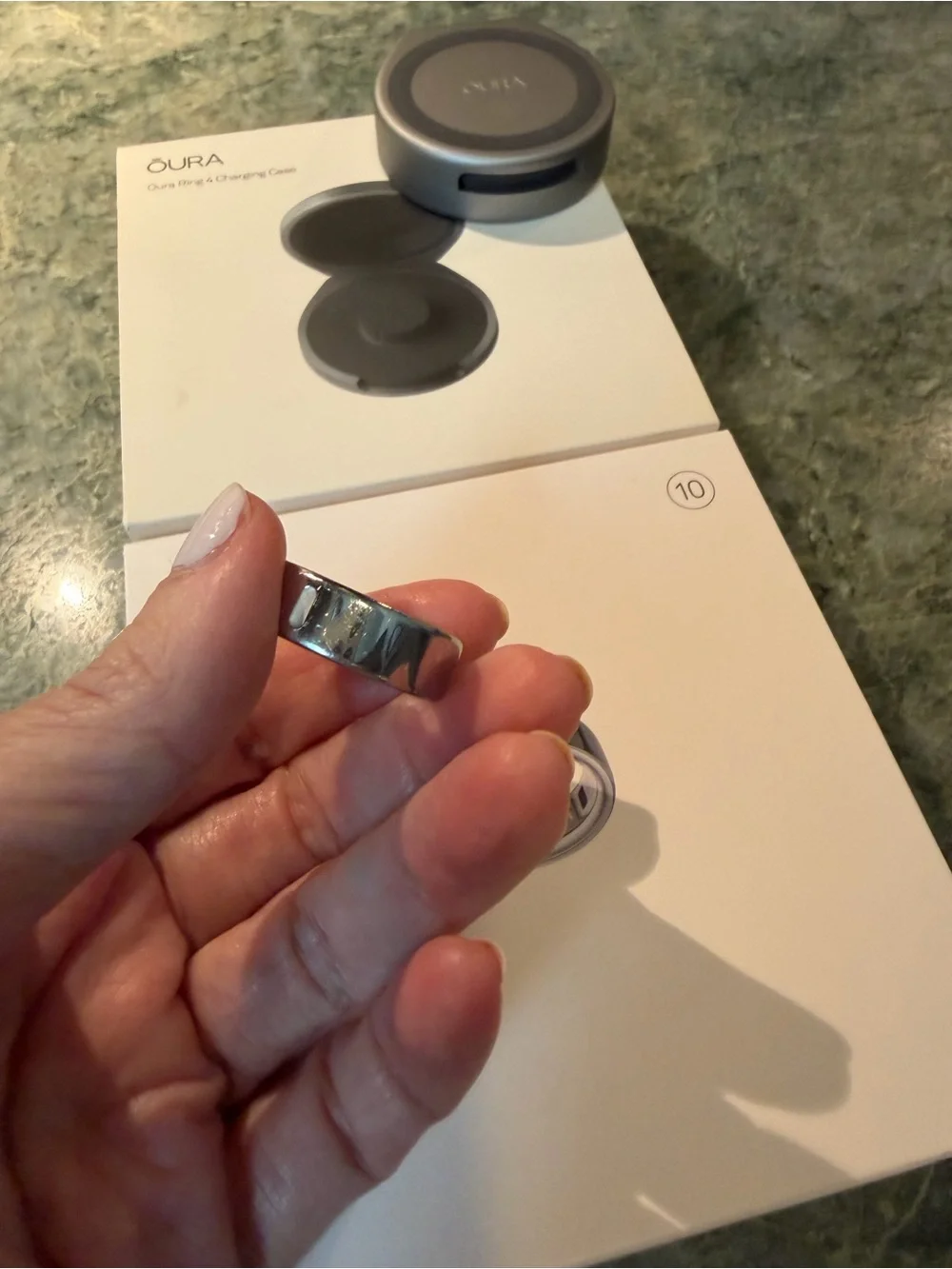 Oura ring 4 size 10 in silver with charging cord PLUS portable charging case.